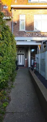 a building with a sign that reads irontoniana at Casa Roberto in Alkmaar