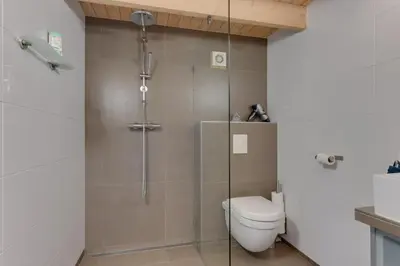 a bathroom with a shower with a toilet in it at 't Hutje centrum Uitgeest in Uitgeest