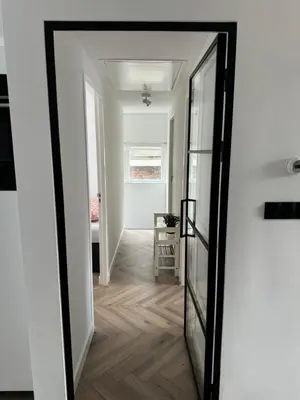 a hallway with a mirror on the wall at Smile home 2, Zaanse schans and Amsterdam Appartements in Wormerveer