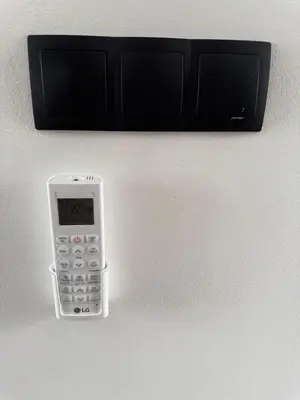 a cell phone is attached to a wall at Smile home 2, Zaanse schans and Amsterdam Appartements in Wormerveer