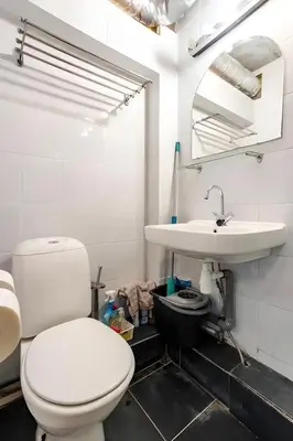 a bathroom with a toilet and a sink at Amsterdam Edge Haven in Purmerend
