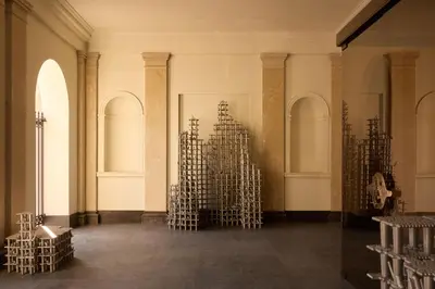 a room with a bunch of metal sculptures in it at Rosewood Amsterdam in Amsterdam