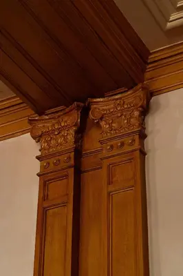 a wooden cabinet in a corner of a room at Rosewood Amsterdam in Amsterdam