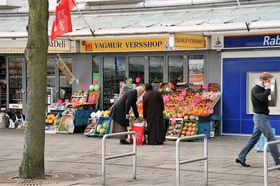 a group of people standing in front of a market at Bright room with kitchen in Amsterdam