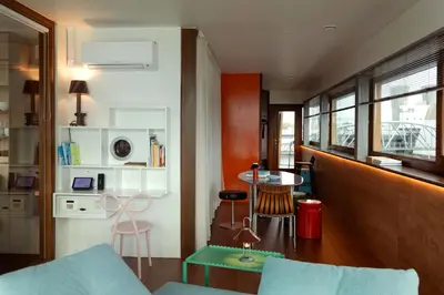 a living room with a couch and a table at SWEETS - Oosterdoksdraaibrug in Amsterdam