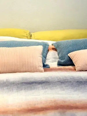 two beds sitting next to each other with pillows at Houseboat PURE II in Vreeland