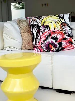 a yellow vase sitting in front of a couch at Houseboat PURE II in Vreeland