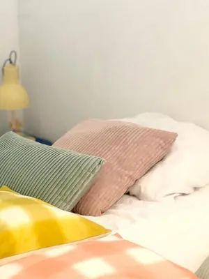a bed with two pillows at Houseboat PURE II in Vreeland