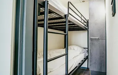 a couple of bunk beds in a room at Havenlodge in Uitgeest