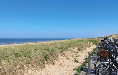 a bunch of bikes parked on the beach at Havenlodge in Uitgeest