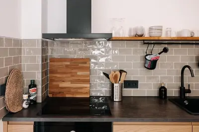 a kitchen with a counter top with a sink at Bella Beach House in Zandvoort