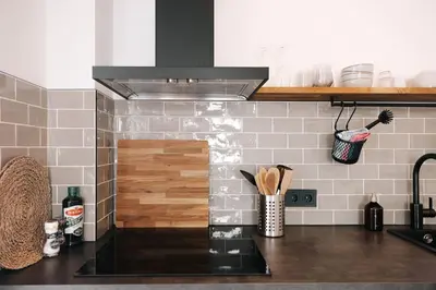 a kitchen with a counter top with a stove at Bella Beach House in Zandvoort