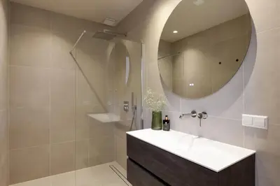 a bathroom with a sink and a mirror at The Ville in Groet