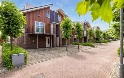 a row of houses on a street at Westergeest Luxe in Uitgeest