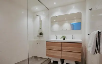 a bathroom with a sink and a shower at Westergeest Luxe in Uitgeest