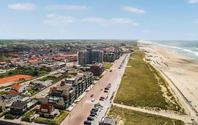 an aerial view of a city and the beach at Appartement Crab in Egmond aan Zee