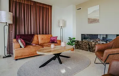 a living room with a couch and a coffee table at Shrimp in Egmond aan Zee