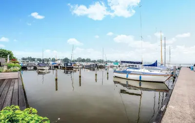 a bunch of boats are docked in a harbor at Westergeest 3 6P in Uitgeest