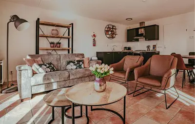 a living room with a couch and a table at Westergeest 3 6P in Uitgeest