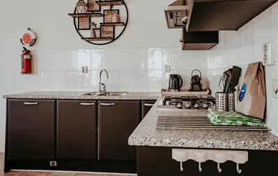 a kitchen with a stove and a counter top at Westergeest 3 6P in Uitgeest