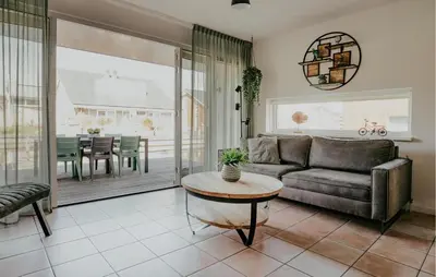 a living room with a couch and a table at Busch & Dam in Uitgeest