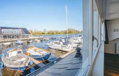 a group of boats docked at a marina at Kraaijennest in Uitgeest