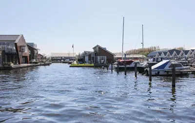 a group of boats are docked in a marina at Kraaijennest in Uitgeest