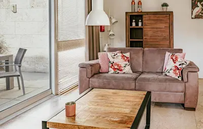 a living room with a couch and a coffee table at Sea Bass in Egmond aan Zee