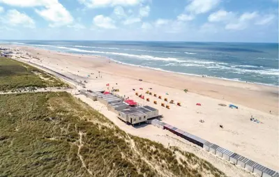 an aerial view of a beach with a train at Lobster in Egmond aan Zee