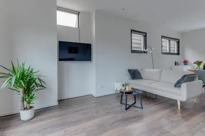 a living room with a couch and a table at B&B aan de Gracht in Alkmaar