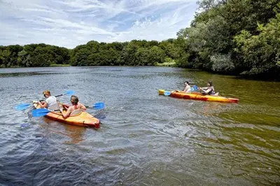 a group of people in kayaks on a river at Motorjacht At Ease in Amsterdam