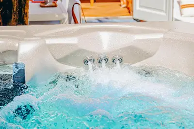 a jacuzzi tub with four faucets in it at 5 O Clock Somewhere in Bergen
