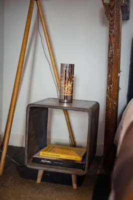 a small tv with a candle on top of it at Yourbnb Suites Kerkstraat in Amsterdam