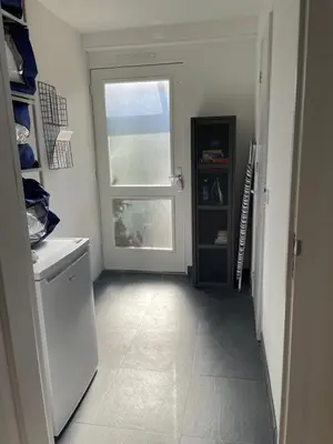 a hallway with a door and a window in a kitchen at The Duck of Amsterdam in Amsterdam