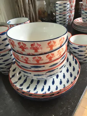 a stack of bowls sitting on top of a counter at Appartement 't Zomerhuis in Zandvoort