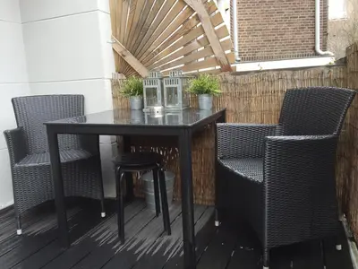 a black table and chairs on a patio at Rosies Place in Amsterdam
