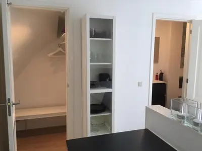 a pantry with a door open to a room at Rosies Place in Amsterdam