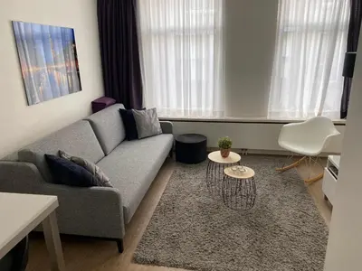 a living room with a couch and a table at Rosies Place in Amsterdam