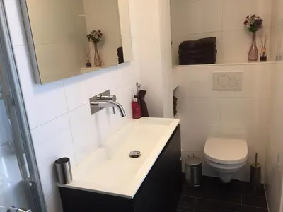 a bathroom with a sink and a toilet at Rosies Place in Amsterdam