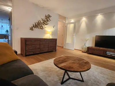 a living room with a couch and a coffee table at Spacious apartment, Canal area, city center in Amsterdam