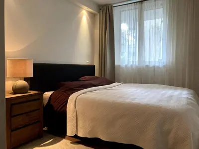a bedroom with a bed and a window at Spacious apartment, Canal area, city center in Amsterdam