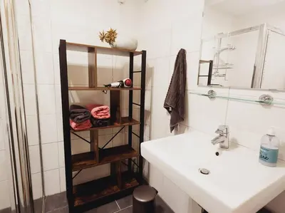 a bathroom with a sink and a mirror at Spacious apartment, Canal area, city center in Amsterdam