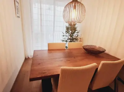 a wooden table with chairs and a bowl on top at Spacious apartment, Canal area, city center in Amsterdam