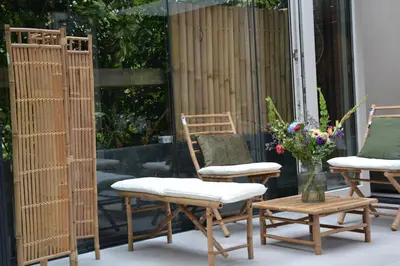 a group of chairs and tables on a patio at The LIF Boutique in Amsterdam