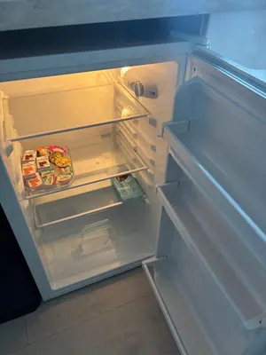 an open refrigerator with its door open and food inside at DE WEELEN met Jacuzzi en of Zwembad Topkeuze Romantiek in Lutjebroek