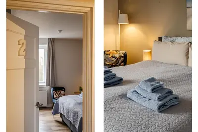 a bedroom with a bed with blue towels on it at Short Stay Zandvoort in Zandvoort