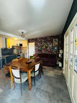 a dining room with a wooden table and chairs at Friend zone in Zaandam