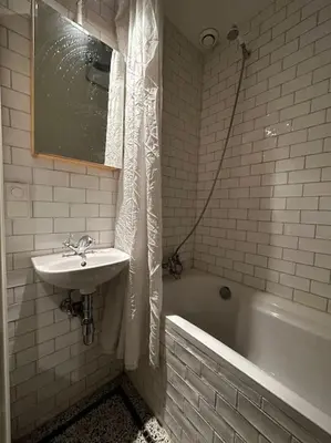 a bathroom with a sink and a bath tub and a sink at De Stijlkamer in Amsterdam
