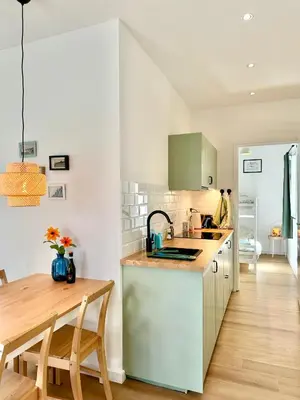 a kitchen with a sink and a counter top at Modern Appartment Free Parking in Zandvoort