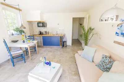 a living room with a couch and a table at B&B Louisehoeve in Linschoten